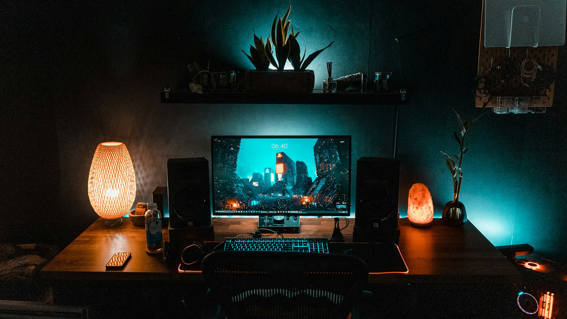 Gaming setup lit in green terminal glow